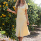 Austia Midi Dress in Yellow OMFORT